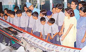 Students of DAV Senior Secondary School, Sector 8, watch newspaper printing at The Tribune office on Thursday. 