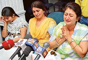 Dolly Sarabjit Singh, wife of the main suspect in the Amritsar TV channel scam, Mr Sarabjit S. Raju, breaks down pleading for justice