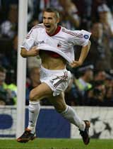 AC Milan's Ukrainian striker Andriy Shevchenko celebrates after scoring the winning penalty
