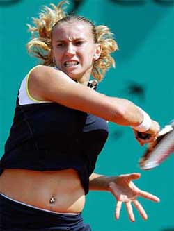 Iroda Tulyaganova of Uzbekistan grimaces after hitting a forehand to Lindsay Davenport 