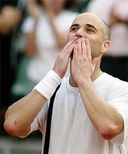 Andre Agassi of the USA salutes the crowd