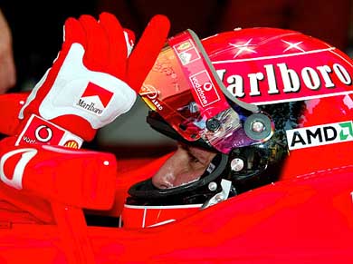 Michael Schumacher of Germany gestures in his Ferrari