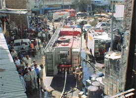 Fire engines douse a fire in Bute Shah Mandi, near Kesar Ganj