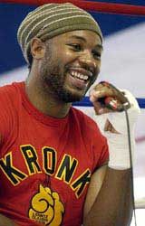 British boxer Lennox Lewis speaks to journalists