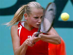 Jelena Dokic of Yugoslavia returns the ball to Tina Pisnik of Slovakia
