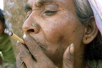 65-year-old Shatni Devi smokes a 'beedi'