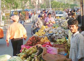 Roadside vendors create traffic bottlenecks outside gate number 4