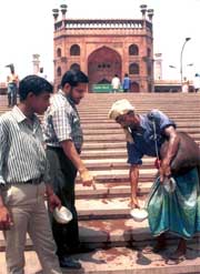 A vendor distributes water