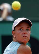 Lindsay Davenport of the USA eyes the ball before making a backhand return