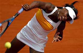 Venus Williams of the USA serves during her match against Silvia Farina Elia of Italy