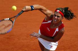 ennifer Capriati of the USA serves during her match against Julia Vakulenko of Ukraine
