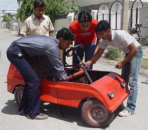 The engineering students with their baby