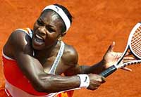 Serena Williams of the USA returns the ball