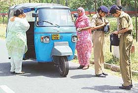 Policewomen check bags of women near the Punjab Chief Minister�s official residence in Chandigarh