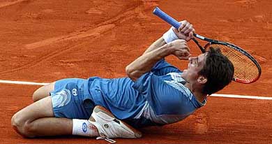 Tommy Robredo of Spain reacts after defeating Gustavo Kuerten of Brazil 