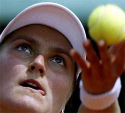 Nadia Petrova of Russia serves during her match against her compatriot Vera Zvonareva
