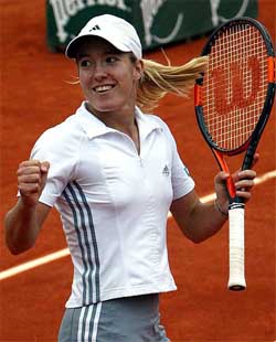 Justine Henin-Hardenne of Belgium celebrates her victory over Chanda Rubin of the US