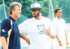 India 'A' coach Sandeep Patil discusses a point with senior team coach John Wright