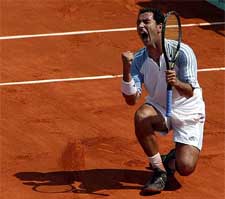 Albert Costa of Spain celebrates his victory over compatriot Tommy Robredo