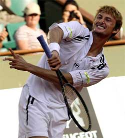 Juan Carlos Ferrero of Spain celebrates his victory over Fernando Gonzalez of Chile