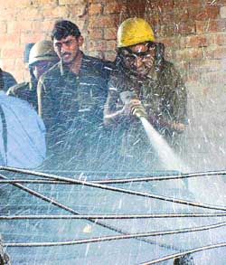 Fireman douse the flames in the shop