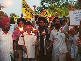SAD activists take part in a torchlight procession in connection with �Ghalughara Week� at the Sector 34 gurdwara in Chandigarh