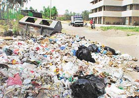 Heaps of hospital waste, including syringes, cotton and kitchen waste, dumped out in the open at Government Medical College and Hospital, Chandigarh