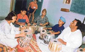 Fateh Singh Gangani gives lessons to students in tabla and pakhawaj during a workshop at the Government College
