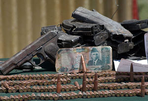 Pakistan currency note of Rs 500 denomination and ammunition recovered from the site of the encounter in which eight militants were killed in the Shopian area of Pulwama district on Friday night. 