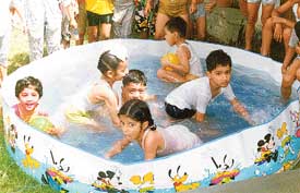 Students of Sri Guru Harkrishan Public School, Doraha, enjoy a bath during the summer camp