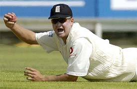 England's Robert Key celebrates after taking the catch of Zimbabwe's Stuart Carlisle 