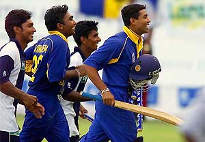 Members of the Sri Lankan team celebrate their victory over the West Indies