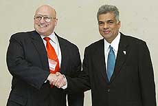 US Deputy Secretary of State Richard Armitage (L) meets Sri Lanka's Prime Minister Ranil Wickremsinghe before an aid conference in Tokyo
