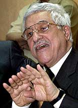 Palestinian Prime Minister Mahmoud Abbas gestures during a news conference