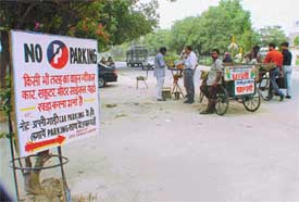 An illegal no-parking signboard put up by a private contractor in Ludhiana to prevent people from parking vehicles 