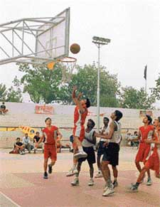 The match between Haryana and Pondichery in progress in the 54th Junior National Basketball Championship