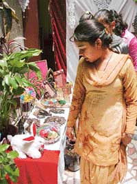 Visitors at an exhibition of handicrafts arranged by students of Gupta Model High School