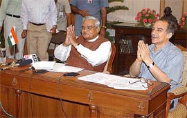Prime Minister Atal Bihari Vajpayee with Information and  Technology Minister Arun Shourie during the launch of the "Vidhya Vahini" project 