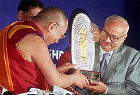 Tibetan spiritual leader Dalai Lama presents the 'Man of Letters' award to former Executive Director of the World Bank Balmiki Prasad Singh