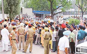 Residents of Mohali village demand closure of the Ranbaxy factory in SAS Nagar on Thursday.