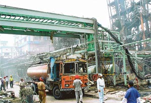 Saving grace: A chemical-carrying tanker at the site of the blast. The tanker withstood the impact of the fire at the Ranbaxy plant in SAS Nagar on Wednesday night. A Tribune photograph