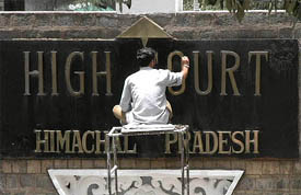 A worker gives finishing touches before the inauguration