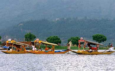 Tourists enjoy Shikara rides on the Dal Lake in Srinagar