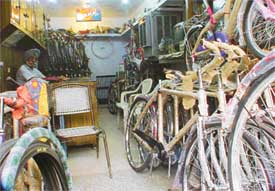 A cycle store owner waits for a customer