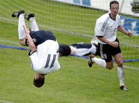 Germany�s Miroslav Klose jumps a summersault