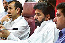 Commissioner M.P. Singh and Mayor Subhash Chawla listen to a debate on privatisation of sanitation at a Municipal Corporation meeting held in Chandigarh