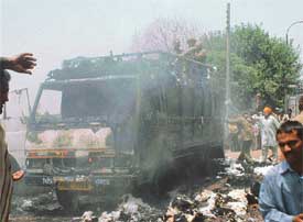 A truck carrying yarn wastage, which caught fire after sparks from a high tension wire set it ablaze on Tibba Road