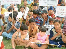 Students of different schools sit in dharna in protest against the fee hike in front of the Deputy Commissioner�s office