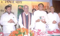 Union ministers Sharad Yadav and Dr C. P. Thakur flank Governor of Gujarat Kailashpati Mishra at the release of audio cassettes containing the poems by the latter in the Capital.
