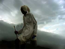 A man walks on a cloudy evening in Bhopal